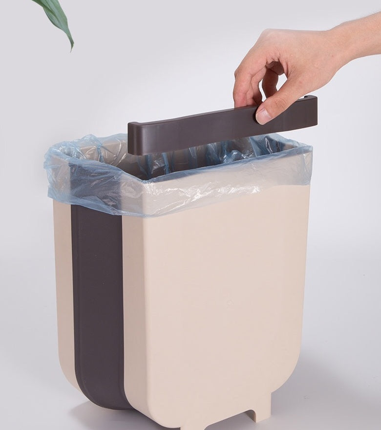 Vinzona foldable wall-mounted trash can for kitchen, space-saving and compact, ideal for organizing waste efficiently.