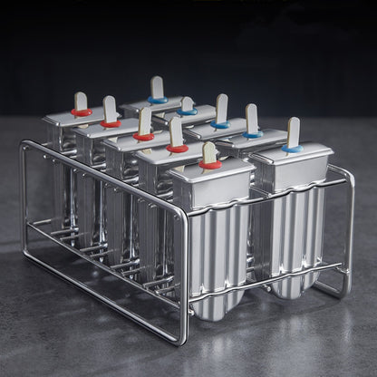 Stainless steel ice cream molds by Vinzona for making reusable homemade popsicles and ice pops in a kitchen setting.