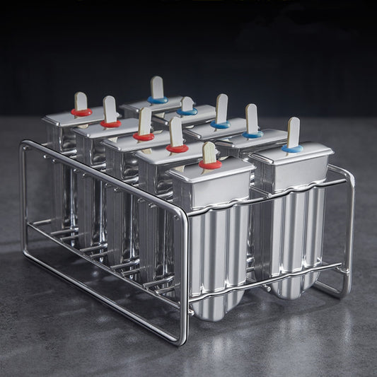 Stainless steel ice cream molds by Vinzona for making reusable homemade popsicles and ice pops in a kitchen setting.