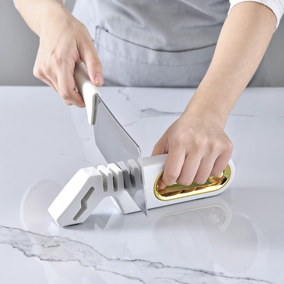 Vinzona 4-in-1 manual knife sharpener with multiple sharpening stages and grinding stone for kitchen knife care.