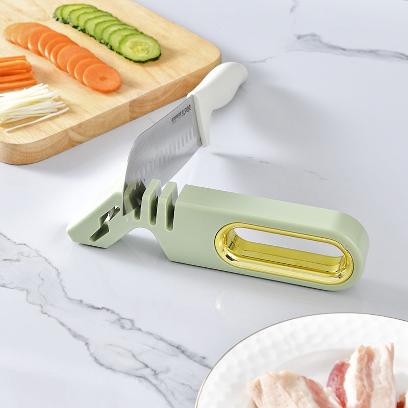 Vinzona 4-in-1 manual knife sharpener with multi-stage grinding stones for kitchen knife sharpening and care.