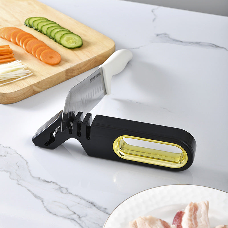 Vinzona 4-in-1 manual knife sharpener with multi-stage grinding stones for kitchen knife maintenance and sharpening.