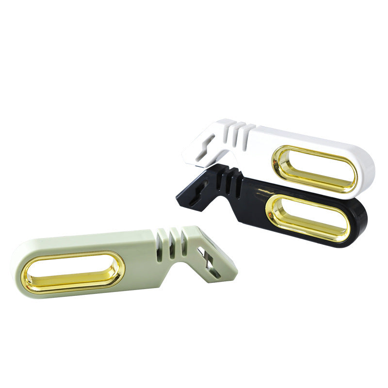 Vinzona 4-in-1 manual knife sharpener with multi-stage grinding stones for kitchen knife sharpening and care.